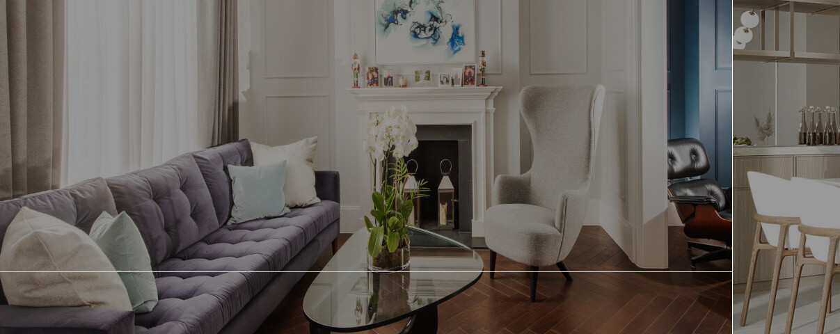 Calm panelled sitting room in London with a classic fireplace and tailored furnishings, from an MVV refurbishment